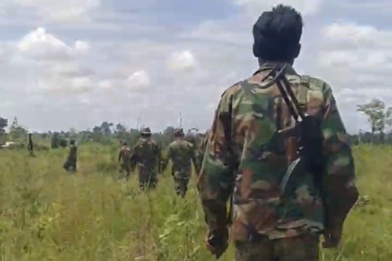 A screenshot from a video of the incident showing a soldier with an AK-47 strapped over his shoulder while other soldiers survey an area of long-disputed land in Siem Reap province, taken on August 28, 2023. (Supplied)