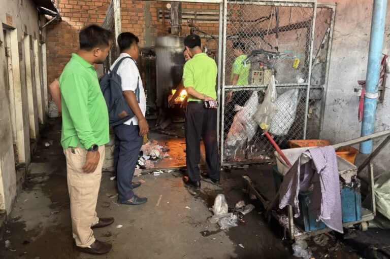Environment Ministry officials inspect a boiler at a garment factory in Phnom Penh following air pollution complaints. July 14, 2026. (Ministry of Environment)