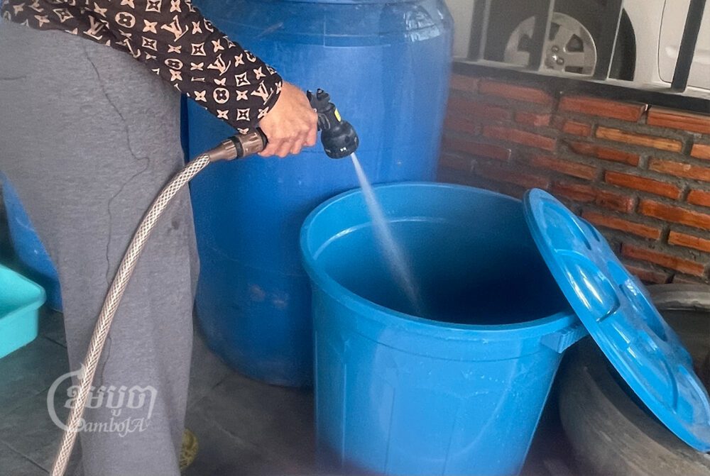 A woman fills up her water container in  Borey Piphub Thmey Chhouk Va II on February 1, 2022. CamboJa/ Pring Samrang 