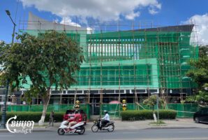 Scaffolding is seen outside the Huione Pay office after its sign was removed in Phnom Penh, Cambodia, May 7, 2025. (CamboJA/Pring Samrang)