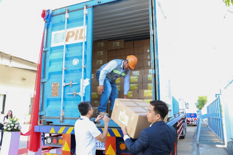 Workers load cases of dried fruit into a container, preparing it for shipment to Australia on August 14, 2025. This marks the first export by Cambodian business Royal Trust Trading to Australia. (Photo: Khiev Chakriya/CAPRED)
