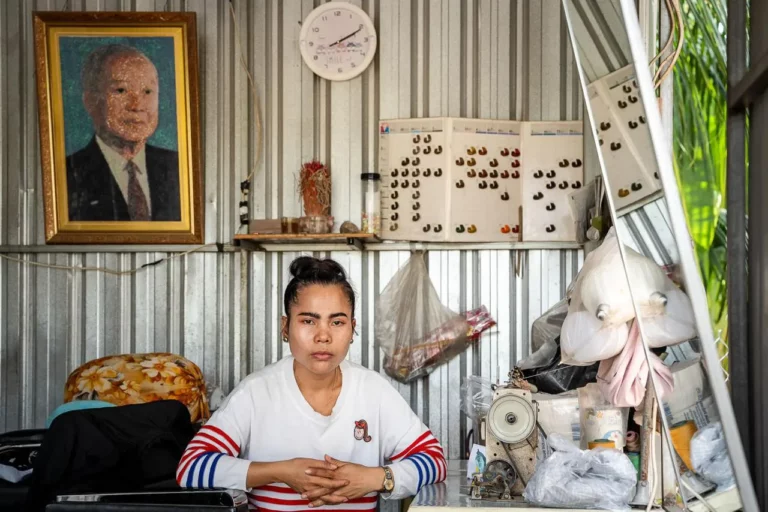 Houn Bopha, 35, at her barbershop in Kandal Province. After losing her job at the casino in 2021 she fell into debt which she still hasn’t been able to pay off. (Photo: Roun Ry/HaRDstories)