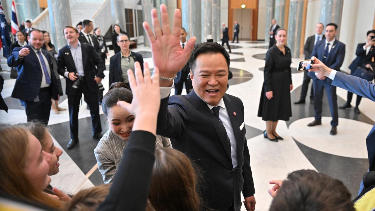 Thailand 's Anutin Charnvirakul enjoys greeting school children in Parliament House. (Mick Tsikas/AAP PHOTOS)